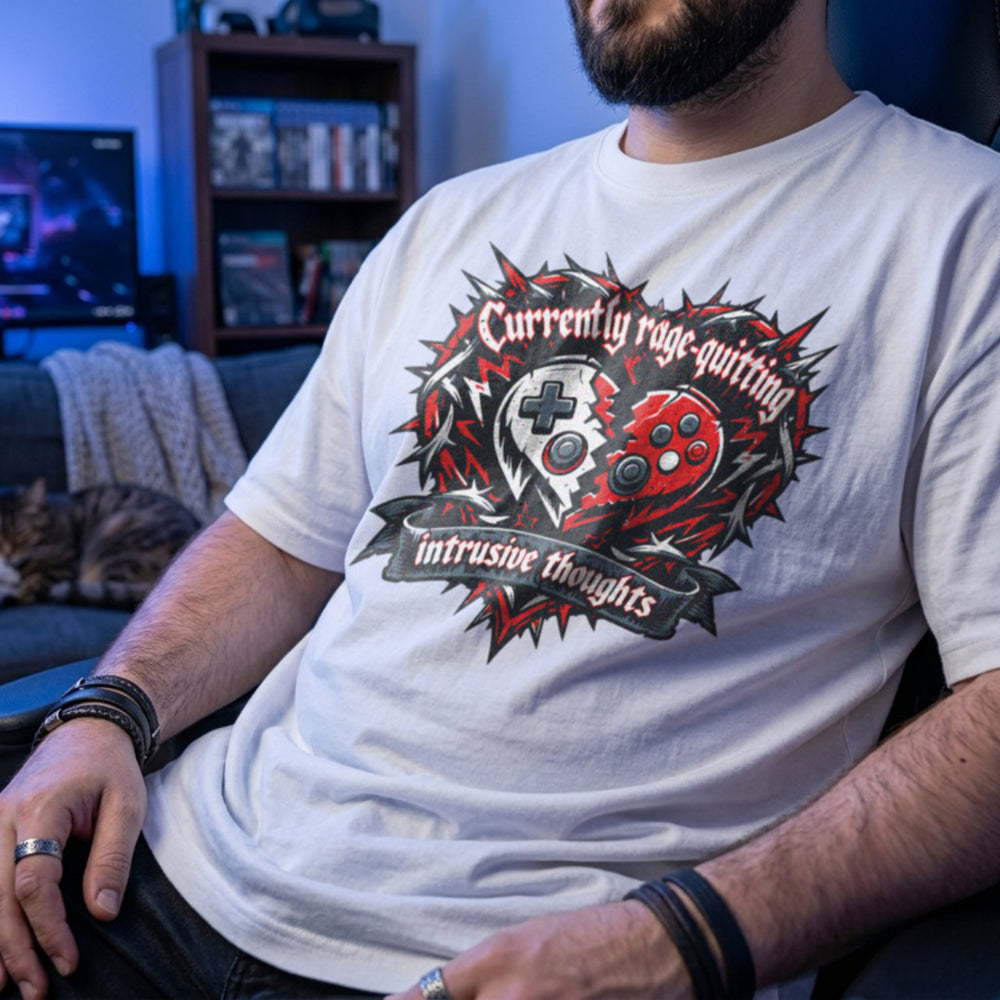 Translation missing: en.White t-shirt featuring a broken controller heart with text: Currently rage-quitting intrusive thoughts