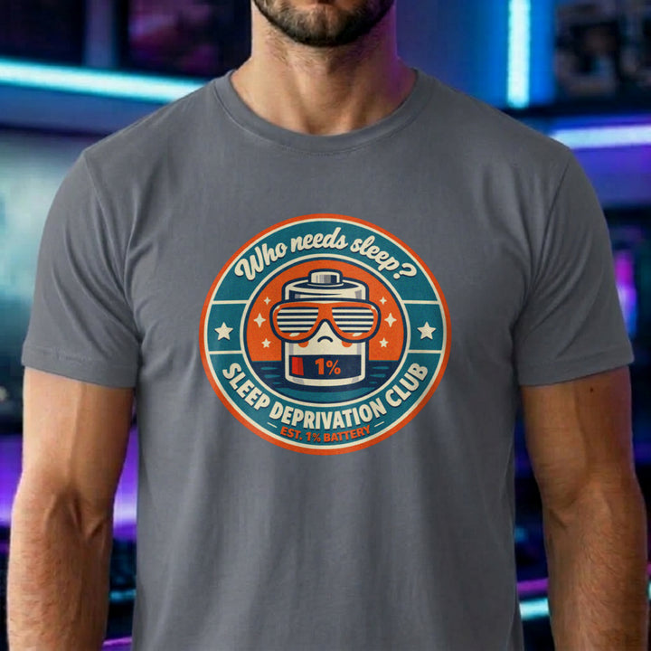 Translation missing: en.Graphite heather t-shirt with a vintage circular badge showing a 1% battery wearing sunglasses and Who Needs Sleep text