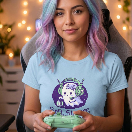 Translation missing: en.Alt n Vibe light blue women's t-shirt with a pixel art ghost wearing a headset and gothic text Soft, Strange, and Still Here