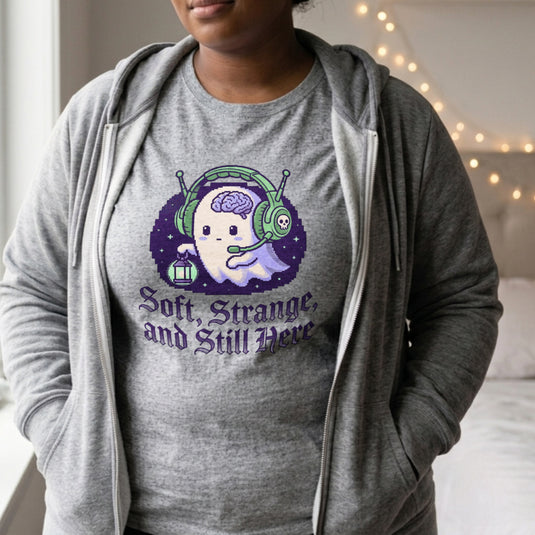 Translation missing: en.Alt n Vibe sports grey women's t-shirt with a pixel art ghost wearing a headset and gothic text Soft, Strange, and Still Here